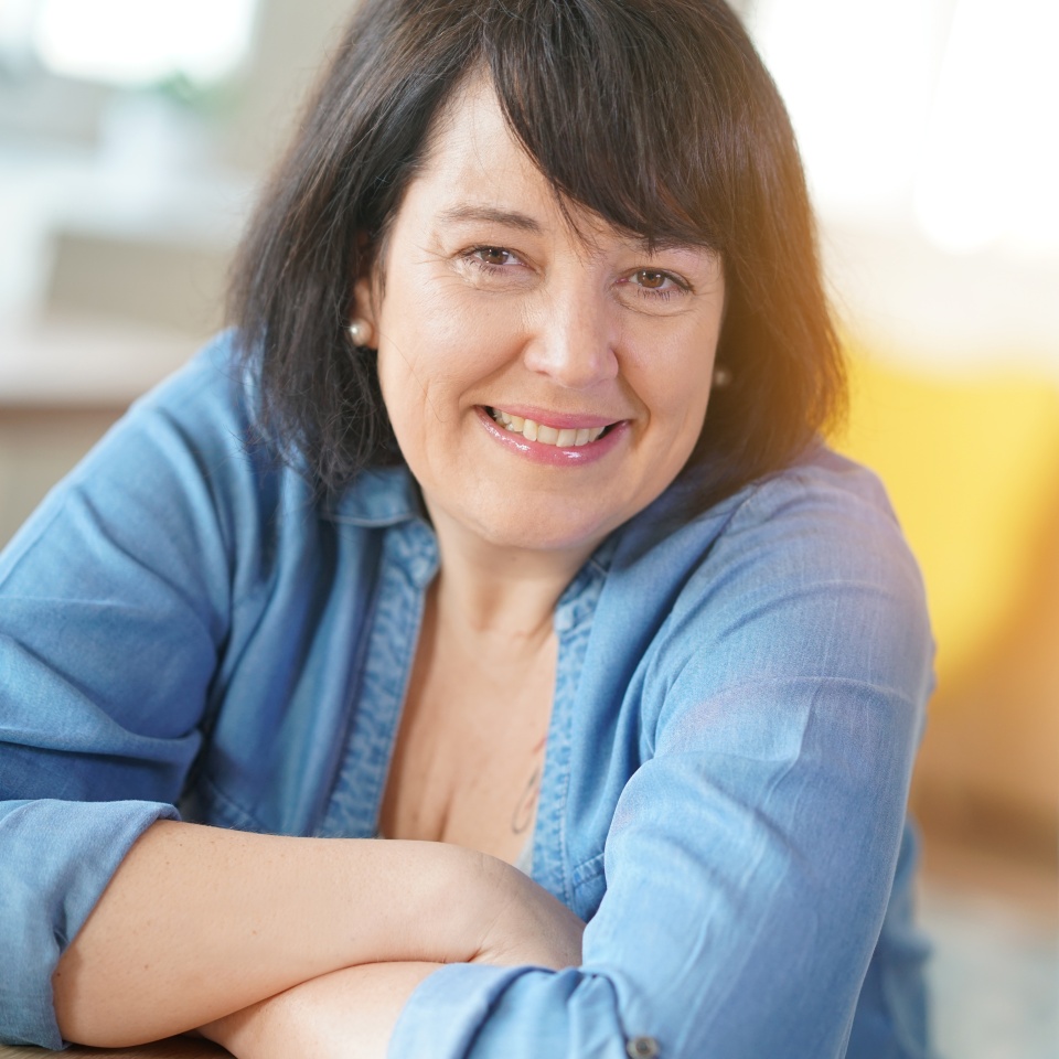 Portrait of smiling 50-year-old woman